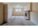 Finished basement space with fireplace, carpet, and two windows at 1060 Heatherwood Ct, Norcross, GA 30093