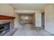 Basement featuring a brick fireplace, carpeted floor, and built in shelves at 1060 Heatherwood Ct, Norcross, GA 30093