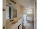 Outdated bathroom featuring a single sink vanity, neutral walls, and tile floor at 1060 Heatherwood Ct, Norcross, GA 30093