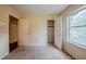 Neutral bedroom with access to the closet and other rooms, window view at 1060 Heatherwood Ct, Norcross, GA 30093