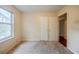 Bedroom with neutral carpet, natural light and double door closet at 1060 Heatherwood Ct, Norcross, GA 30093