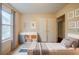 Cozy bedroom with soft natural light, featuring a serene ambiance and practical furniture, perfect for relaxation at 1060 Heatherwood Ct, Norcross, GA 30093