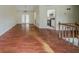 Open living area with hardwood floors, seamlessly connected to the kitchen at 1060 Heatherwood Ct, Norcross, GA 30093