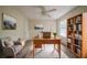 Well-lit home office with built-in bookshelves and ample workspace, perfect for productivity and comfortable remote work at 1060 Heatherwood Ct, Norcross, GA 30093