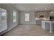 Well-lit kitchen with stainless appliances, ample counter space, and convenient access to the outdoors at 111 Felicity Pike, Locust Grove, GA 30248