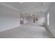 Expansive main bedroom with tray ceiling, ceiling fan, carpeted floor and ensuite bathroom access at 111 Felicity Pike, Locust Grove, GA 30248