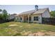 View of backyard featuring well-maintained lawn and fence at 2124 Bullock Bluff Dr, Loganville, GA 30052