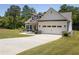New single-Gathering home with a long driveway and a two-car garage at 2124 Bullock Bluff Dr, Loganville, GA 30052