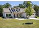 Inviting single-Gathering home with a well-manicured lawn and charming landscaping elements at 2124 Bullock Bluff Dr, Loganville, GA 30052