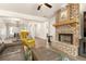 Comfortable living room with a brick fireplace and an inviting atmosphere at 2124 Bullock Bluff Dr, Loganville, GA 30052
