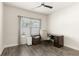 Bright office space with a dark desk and wood floors at 2124 Bullock Bluff Dr, Loganville, GA 30052