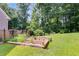 Backyard with garden beds and mature trees at 2368 Glynn Se Dr, Atlanta, GA 30316