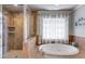 Bathroom features a large soaking tub and tiled shower at 2368 Glynn Se Dr, Atlanta, GA 30316