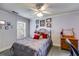 Cozy bedroom featuring a ceiling fan, carpet, and a window that provides natural light at 2368 Glynn Se Dr, Atlanta, GA 30316