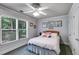 Comfortable bedroom with large window, ceiling fan, and closet space at 2368 Glynn Se Dr, Atlanta, GA 30316