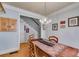 Bright dining room featuring a chandelier, wooden table, and access to stairs at 2368 Glynn Se Dr, Atlanta, GA 30316
