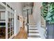 Inviting entryway with hardwood floors, staircase, and view into other rooms of the house at 2368 Glynn Se Dr, Atlanta, GA 30316
