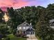 Beautiful two-story home nestled among lush trees with a well-manicured lawn at 2368 Glynn Se Dr, Atlanta, GA 30316