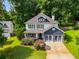 Beautiful two-story home with a well-manicured lawn and lush landscaping at 2368 Glynn Se Dr, Atlanta, GA 30316