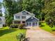 Beautiful two-story home with a well-manicured lawn and lush landscaping at 2368 Glynn Se Dr, Atlanta, GA 30316