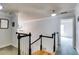 Upstairs hallway with hardwood floors, black and white banister, and neutral walls at 2368 Glynn Se Dr, Atlanta, GA 30316
