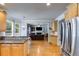 Open kitchen layout with view into the living room, stainless refrigerator and granite countertops at 2368 Glynn Se Dr, Atlanta, GA 30316