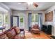 Cozy living room featuring hardwood floors, a comfortable couch, and ample natural light at 2368 Glynn Se Dr, Atlanta, GA 30316