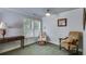 Relaxing sitting area, features a window providing natural light, two chairs and a side table at 2368 Glynn Se Dr, Atlanta, GA 30316
