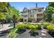 Spacious back exterior featuring a pool, spa, landscaping, and balconies at 307 Heritage Overlook, Woodstock, GA 30188