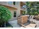 Backyard with a stone outdoor kitchen and a covered second story deck at 307 Heritage Overlook, Woodstock, GA 30188