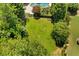 Expansive green backyard surrounded by lush trees, offering privacy and space at 307 Heritage Overlook, Woodstock, GA 30188