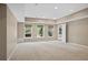 Finished basement featuring three windows providing natural light and recessed lighting at 307 Heritage Overlook, Woodstock, GA 30188