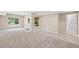 Spacious basement area with natural light, neutral tones, carpet, and ceramic flooring at 307 Heritage Overlook, Woodstock, GA 30188