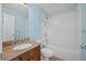 Bright bathroom with single sink, granite countertop, and a tub-shower combo at 307 Heritage Overlook, Woodstock, GA 30188