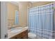 Bathroom with shower, toilet, vanity, granite countertop, and mirror at 307 Heritage Overlook, Woodstock, GA 30188