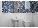 Charming powder room with pedestal sink, and decorative wallpaper at 307 Heritage Overlook, Woodstock, GA 30188