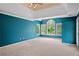 Primary bedroom suite with tray ceiling and multiple windows offering ample natural light at 307 Heritage Overlook, Woodstock, GA 30188