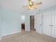 Light-filled bedroom showing doorway to bathroom, closet and neutral carpet at 307 Heritage Overlook, Woodstock, GA 30188