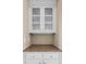 Butler's pantry with granite countertop and storage, adding functionality and style to the home at 307 Heritage Overlook, Woodstock, GA 30188