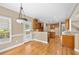 Inviting dining area featuring hardwood floors and an open layout connecting to the kitchen at 307 Heritage Overlook, Woodstock, GA 30188
