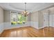 Dining room with large windows and elegant chandelier, ideal for Gathering meals and entertaining guests at 307 Heritage Overlook, Woodstock, GA 30188