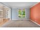 Inviting entryway with hardwood floors, a staircase, and a view into the living area and front door at 307 Heritage Overlook, Woodstock, GA 30188