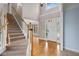 Spacious foyer with hardwood flooring, a staircase, and a front door with sidelights at 307 Heritage Overlook, Woodstock, GA 30188