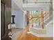 Grand foyer featuring hardwood floors, a staircase, and views into the living room at 307 Heritage Overlook, Woodstock, GA 30188