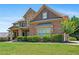 Charming two-story brick home with stone accents and a well-manicured lawn at 307 Heritage Overlook, Woodstock, GA 30188