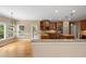 Spacious kitchen with stainless steel appliances, granite countertops, and a view of the backyard at 307 Heritage Overlook, Woodstock, GA 30188