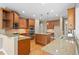 Gourmet kitchen featuring granite countertops, stainless steel appliances, and ample cabinet space at 307 Heritage Overlook, Woodstock, GA 30188