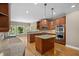 Gourmet kitchen with stainless steel appliances, island, and ample cabinet space, designed for culinary enthusiasts at 307 Heritage Overlook, Woodstock, GA 30188