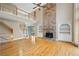 Open-concept living room featuring a fireplace and second story landing, creating a grand and inviting space at 307 Heritage Overlook, Woodstock, GA 30188