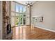 Spacious living room with tall windows and a fireplace, filling the room with natural light and warmth at 307 Heritage Overlook, Woodstock, GA 30188